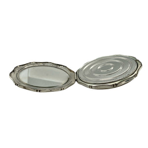 Bring vintage charm to your collection with this pre-owned 925 silver compact mirror, featuring an elegant patterned exterior and a timeless design perfect for gifting or personal use.

Design: The compact showcases a beautifully patterned outer surface, offering classic style with a touch of refinement.
Material: Made from 925 sterling silver, the polished and detailed finish enhances its decorative appeal while ensuring lasting quality.
Mirror Detail: This functional piece combines beauty
