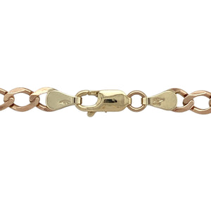 Bring warm-toned elegance to your collection with this pre-owned 9ct yellow/rosey gold 22" curb chain, offering classic style with a subtle blush hue—perfect for everyday wear or layered looks.

Design: The chain features traditional flat curb links in a soft yellow/rosey gold tone, providing a refined and timeless aesthetic.
Material: Made from yellow/rosey 9-carat gold, the polished finish enhances the gentle warmth of the metal and the smooth interlocking link design.
