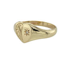 Load image into Gallery viewer, Add a touch of charm and sparkle to your collection with this pre-owned 9ct yellow gold diamond set heart signet ring—sweetly styled with meaningful detail.

Design: The ring features a 9mm high heart-shaped face with delicate patterning and a single diamond accent, adding subtle brilliance to its romantic design.
Material: Made from 9-carat yellow gold, the polished finish enhances the intricate detailing and gives the piece a warm, elegant glow.

