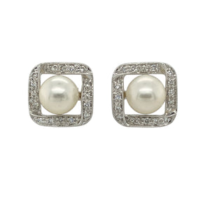 Add classic elegance with a modern twist to your collection with these pre-owned 14ct white gold diamond and pearl stud earrings—timeless sophistication with a touch of sparkle.

Design: Each earring features a lustrous 8mm round pearl at the centre, surrounded by a square frame set with sparkling diamonds in polished white gold for a striking contrast.
Material: Made from 14-carat white gold, the sleek, cool-toned finish enhances the brilliance of the diamonds and the natural beauty of the pearls.