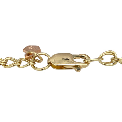 Celebrate heritage and heartfelt symbolism with this pre-owned 9ct yellow and rose gold Clogau charm bracelet—beautifully detailed and rich in meaning.

Design: This 7" bracelet features 4mm wide polished links in yellow and rose gold, adorned with three iconic Clogau charms: a daffodil for Welsh pride, a lovespoon for affection, and a sunflower symbolising joy and positivity.
Material: Made from 9-carat yellow gold with rare Welsh rose gold accents