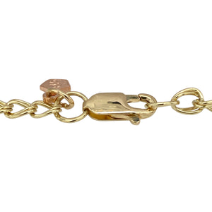 Celebrate heritage and heartfelt symbolism with this pre-owned 9ct yellow and rose gold Clogau charm bracelet—beautifully detailed and rich in meaning.

Design: This 7" bracelet features 4mm wide polished links in yellow and rose gold, adorned with three iconic Clogau charms: a daffodil for Welsh pride, a lovespoon for affection, and a sunflower symbolising joy and positivity.
Material: Made from 9-carat yellow gold with rare Welsh rose gold accents