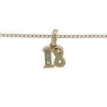 Load image into Gallery viewer, Celebrate a milestone in style with this pre-owned 9ct yellow gold and diamond set &#39;18&#39; pendant necklace—a meaningful piece with a touch of sparkle, perfect for marking a special birthday or occasion.

Design: The pendant features the number &#39;18&#39; in a bold, openwork design, accented with a single diamond for added sparkle. Measuring 1.3cm long including the bail, it offers a subtle yet celebratory look.

