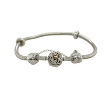 Load image into Gallery viewer, Blend timeless style with meaningful detail in this pre-owned Clogau 7.5&quot; charm bracelet—crafted in 925 silver with 9ct rose gold accents for a beautifully finished and secure foundation for your charms.

Design: The bracelet features a classic charm bracelet design with two stopper charms to keep your collection in place, and a decorative ball-shaped safety link charm engraved with the signature Tree of Life pattern across the clasp.

