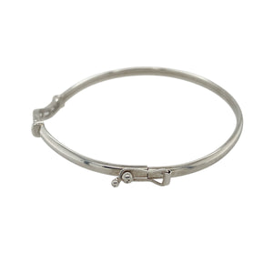 Add refined sparkle and modern elegance to your collection with this pre-owned 9ct white gold and cubic zirconia set bangle—sleek, understated, and perfect for everyday sophistication.

Design: The bangle features a slim front adorned with cubic zirconia stones, offering a delicate shimmer across its 3mm wide surface.
Material: Made from 9-carat white gold, the polished finish enhances the brilliance of the stones and provides a clean, contemporary look.
