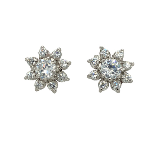 Bring delicate sparkle and floral charm to your jewellery collection with these pre-owned 9ct white gold flower stud earrings, featuring shimmering cubic zirconia stones in a timeless design—perfect for everyday elegance or subtle occasion wear.

Design: Each stud features a 4mm diameter cubic zirconia at the centre, surrounded by smaller stones arranged in a floral pattern. The design offers a soft, feminine look with eye-catching brilliance.
