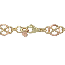 Load image into Gallery viewer, Bring bold heritage style and meaningful design to your collection with this pre-owned 9ct yellow and rose gold Clogau Celtic Infinity Knot necklace, showcasing striking craftsmanship and timeless symbolism—perfect for statement wear with lasting significance.

Design: This 20-inch necklace features a continuous arrangement of Celtic infinity knot links, each approximately 10mm wide, crafted in alternating yellow and rose gold. The iconic knot symbolises eternity, unity, and unbreakable connection.

