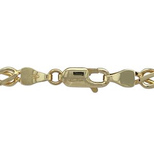 Bring symbolic elegance and bold craftsmanship to your collection with this pre-owned 9ct yellow gold Celtic knot chain, featuring intricate links with timeless meaning—perfect for heritage-inspired style with a standout finish.

Design: This 18-inch chain features detailed Celtic knot links, each approximately 5mm wide, forming a continuous pattern that symbolises eternity, unity, and interconnectedness. The ornate design offers both visual interest and cultural significance.
