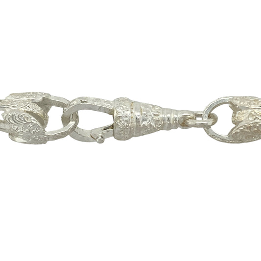 Bring floral-inspired boldness and intricate detail to your jewellery collection with this new 925 silver 24.5" patterned tulip link chain—a striking piece with elegant curves and commanding presence.

Design: Featuring 13mm wide tulip-shaped links with detailed patterning, this chain blends botanical elegance with strong structural design.
Material: Made from solid 925 sterling silver, the polished and engraved finishes highlight the natural contours and texture of each tulip-inspired link.
