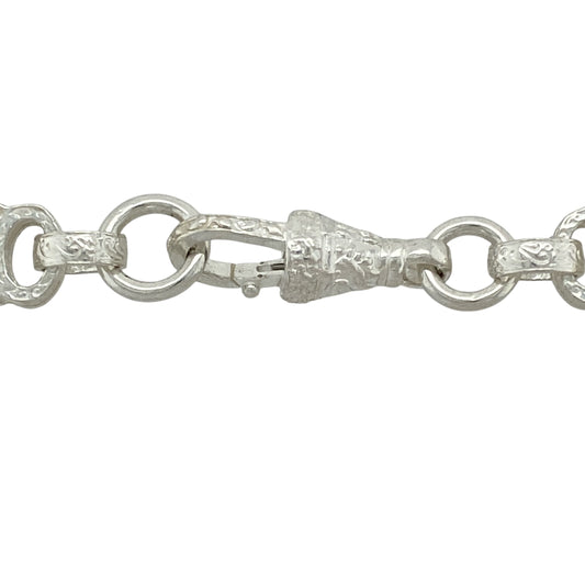 Bring bold symmetry and detailed craftsmanship to your jewellery collection with this new 925 silver 24" patterned star and bar chain—a striking piece with geometric flair and classic shine.

Design: Featuring 9mm wide alternating star and bar links with engraved patterning, this chain delivers a balanced and eye-catching look with unique structural appeal.
Material: Made from solid 925 sterling silver, the polished and textured finishes enhance the bold lines and intricate details of each link.
