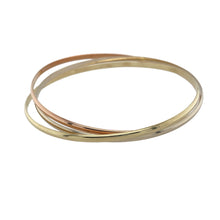 Load image into Gallery viewer, Bring elegant movement and timeless style to your collection with this pre-owned 9ct yellow, rose, and white gold triple band crossover bangle—a refined piece with graceful versatility.

Design: This bangle features three interlocking bands—one each in yellow, rose, and white gold—each approximately 2.5mm wide, creating a fluid crossover design that sits at approximately 5mm in total width.


