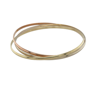 Bring elegant movement and timeless style to your collection with this pre-owned 9ct yellow, rose, and white gold triple band crossover bangle—a refined piece with graceful versatility.

Design: This bangle features three interlocking bands—one each in yellow, rose, and white gold—each approximately 2.5mm wide, creating a fluid crossover design that sits at approximately 5mm in total width.
