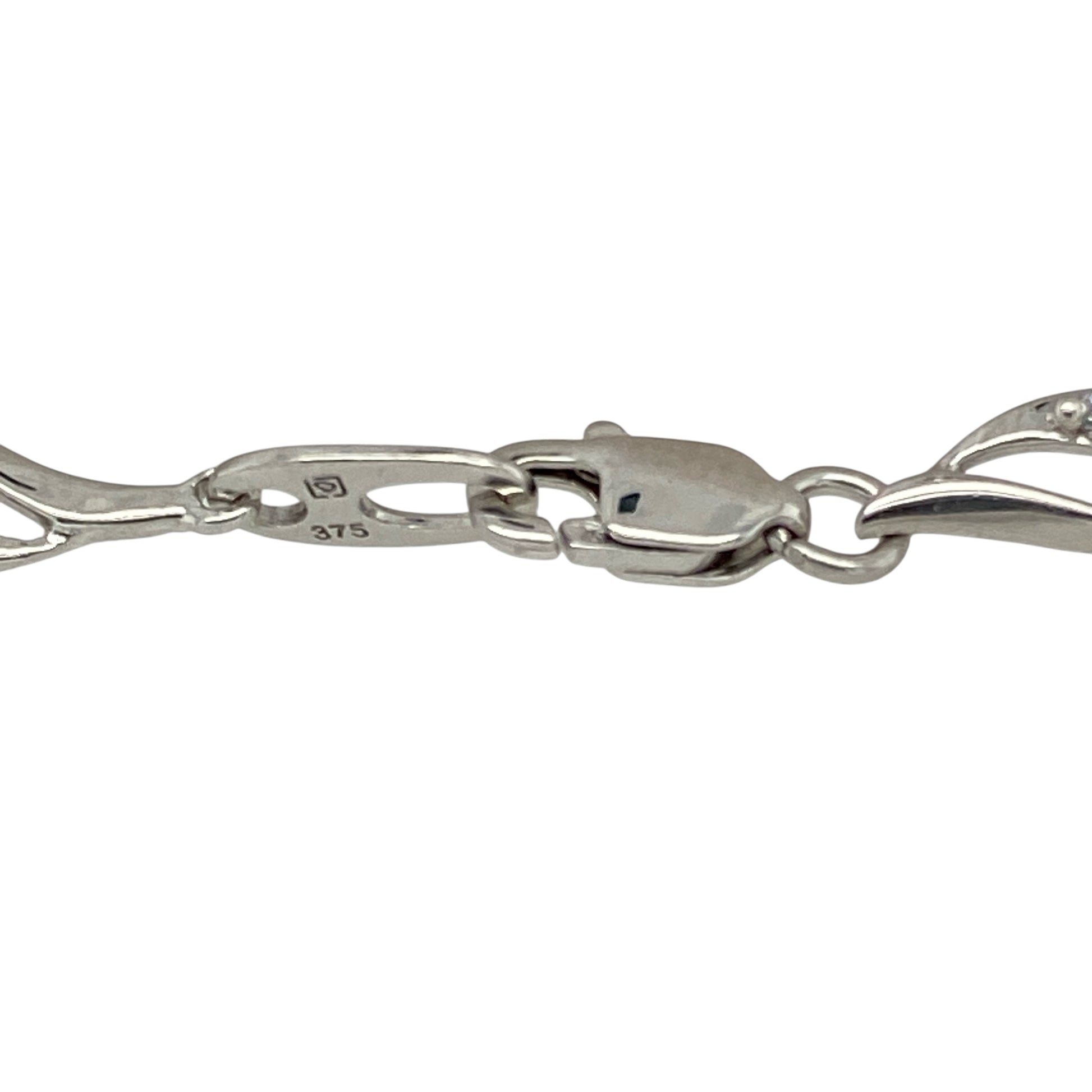 Add sparkle and sophistication to your wrist with this pre-owned 9ct white gold and cubic zirconia set curved link bracelet—a refined design that blends graceful movement with radiant detail.

Design: Featuring elegant 4mm wide curved links, each section is set with shimmering cubic zirconia to create a fluid, light-catching effect across the full 7.25" length.
Material: Made from 9-carat white gold, the sleek polished finish enhances the brilliance of the stones and adds a cool, contemporary shine.
