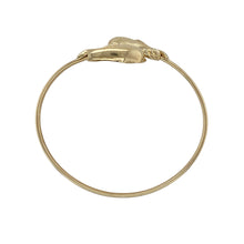 Load image into Gallery viewer, Celebrate playful elegance and ocean-inspired charm with this pre-owned 9ct yellow gold diamond set wrap over dolphin bangle—a distinctive design full of character and sparkle.

Design: The 15mm high front features two dolphins in a wrap-over style, their forms meeting at the centre and accented with sparkling diamonds for added brilliance.
Material: Made from 9-carat yellow gold, the polished finish enhances the sculpted detail and the shimmer of the diamond accents.


