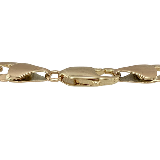 Make a bold statement with this pre-owned 9ct yellow gold 8.5" curb bracelet—a heavyweight classic designed for confident, everyday style.

Design: Featuring 9mm wide curb links, the bracelet showcases a traditional interlocking pattern with a smooth, flat profile for a sleek and substantial look.
Material: Made from 9-carat yellow gold, the polished finish enhances the rich tone and strong presence of the design.
