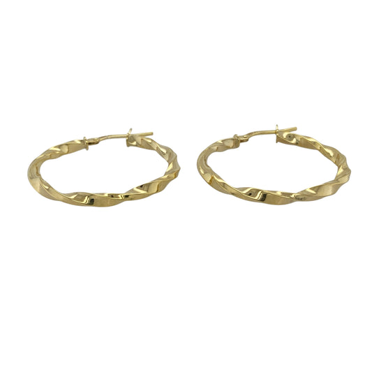 Bring warm elegance and modern texture to your collection with these new 9ct yellow gold twisted hoop creole earrings, offering a stylish design and timeless shine—perfect for adding a refined touch to any look.

Design: The earrings feature a sleek twisted hoop creole style, measuring approximately 25mm in diameter. The twisted detailing creates a dynamic, eye-catching effect that adds depth and movement.
