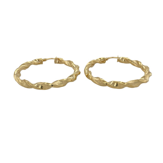 Bring modern elegance and striking texture to your collection with these new 9ct yellow gold brushed effect twisted hoop creole earrings, offering a bold design and sophisticated shine—perfect for making a standout statement.

Design: The earrings feature a large twisted hoop creole style with a brushed effect finish, measuring approximately 40mm in diameter. The combination of the flowing twist and soft brushed texture creates a dynamic, contemporary look that catches the light beautifully.
