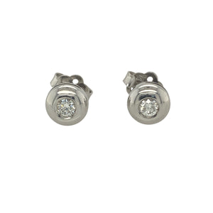 Bring refined sparkle and timeless sophistication to your collection with these pre-owned 18ct white gold and diamond set button stud earrings, offering a beautiful blend of classic elegance and subtle brilliance—perfect for any occasion.

Design: Each earring features a sleek button-style design set with an approximate 0.08ct diamond, creating a graceful, understated sparkle. The earrings contain approximately 0.16ct of diamond content in total, adding just the right touch of refined shine.
