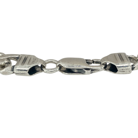 Bring classic strength and refined style to your collection with this pre-owned 925 silver 8.5" curb bracelet, offering a timeless blend of bold design and elegant simplicity—perfect for any occasion.

Design: The bracelet features a traditional curb link design with a 9mm width, creating a sleek and polished look that adds a confident touch to any outfit.
Material: Made from 925 silver, the polished finish enhances the bright, clean tone and highlights the smooth, interlocking links beautifully.
