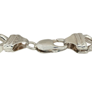 Bring bold sophistication and timeless style to your collection with this pre-owned 925 silver 9" curb bracelet, offering a striking blend of classic design and strong presence—perfect for making a confident statement.

Design: The bracelet features a traditional curb link design with a substantial 12mm width, creating a polished and powerful look that stands out beautifully on the wrist.
