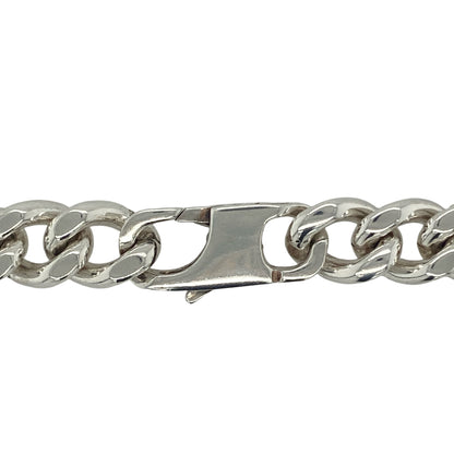 Bring bold sophistication and striking presence to your collection with this pre-owned 925 silver 18" curb chain, offering a powerful blend of classic design and substantial weight—perfect for making an unmistakable statement.

Design: The chain features a traditional curb link design with an impressive 11mm width, creating a strong, polished look that demands attention and adds confident style to any outfit.
