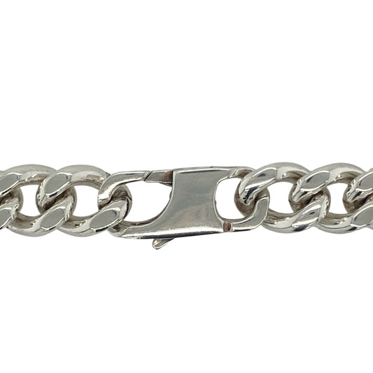 Bring bold sophistication and striking presence to your collection with this pre-owned 925 silver 18" curb chain, offering a powerful blend of classic design and substantial weight—perfect for making an unmistakable statement.

Design: The chain features a traditional curb link design with an impressive 11mm width, creating a strong, polished look that demands attention and adds confident style to any outfit.
