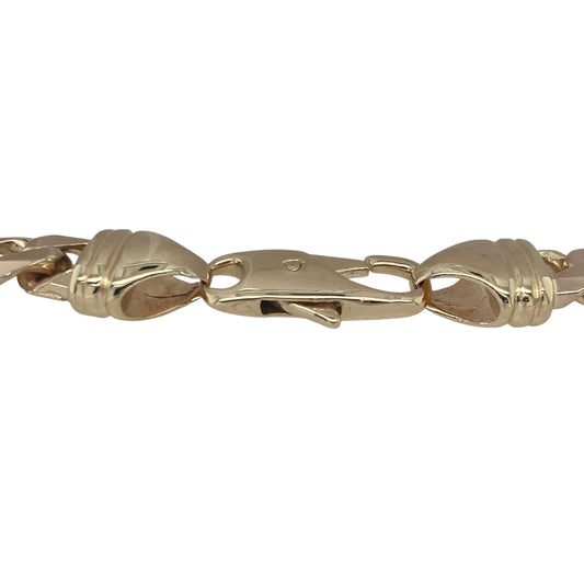 Bring bold presence and timeless craftsmanship to your collection with this pre-owned 9ct yellow gold 9.5" curb bracelet—a substantial and stylish piece with classic appeal.

Design: The bracelet features traditional flat curb links measuring 7mm wide, offering a sleek, polished look that drapes comfortably along the wrist.
Material: Made from 9-carat yellow gold, the high-shine finish enhances the strong link design and delivers a warm, rich glow.

