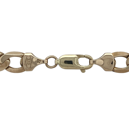 Bring bold sophistication and timeless strength to your collection with this pre-owned 9ct yellow gold 20" curb chain—a classic heavyweight piece with striking presence and enduring style.

Design: The chain features traditional flat curb links measuring 8mm in width, offering a clean, polished profile with a bold, masculine edge.
Material: Made from 9-carat yellow gold, the high-shine finish enhances the smooth link surfaces and delivers a rich, luxurious glow.
