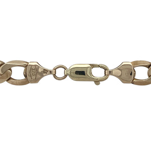 Bring bold sophistication and timeless strength to your collection with this pre-owned 9ct yellow gold 20" curb chain—a classic heavyweight piece with striking presence and enduring style.

Design: The chain features traditional flat curb links measuring 8mm in width, offering a clean, polished profile with a bold, masculine edge.
Material: Made from 9-carat yellow gold, the high-shine finish enhances the smooth link surfaces and delivers a rich, luxurious glow.

