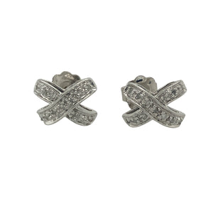 Bring subtle sparkle and romantic charm to your collection with these pre-owned 9ct white gold and diamond set kiss stud earrings—a delicate design with timeless elegance and symbolic style.

Design: The earrings feature an elegant "X" kiss shape, each set with sparkling diamonds for a refined, love-inspired look that’s perfect for any occasion.
Material: Made from 9-carat white gold, the polished finish enhances the brilliance of the diamonds and offers a cool, modern shine.
