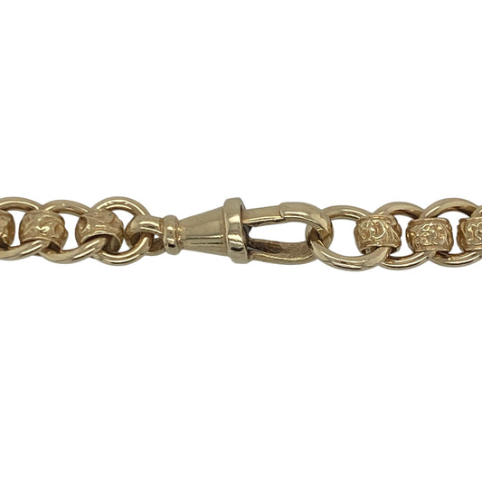 Make a powerful impression with this pre-owned 9ct yellow gold patterned rollerball chain—bold, weighty, and full of character.

Design: This 22-inch rollerball chain features 7mm wide rounded links with detailed patterning, offering a unique textured finish that stands out from every angle.
Material: Made from 9-carat yellow gold, the rich tone and polished surface provide a luxurious feel with a statement-making edge.
