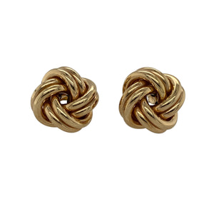 Classic and stylish, these pre-owned 9ct yellow gold knot stud earrings offer timeless elegance with a bold twist—perfect for elevating everyday looks or adding polish to special occasions.

Design: Each earring features a 14mm knot design, symbolising unity and eternity, with smooth, interwoven loops creating a refined and dimensional look.
Material: Made from 9-carat yellow gold, the polished finish enhances the soft curves and classic shine of the design.
