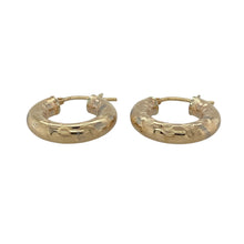 Load image into Gallery viewer, Stylish and eye-catching, these pre-owned 9ct yellow gold creole earrings feature bold stripe detailing—perfect for adding texture and shine to your everyday look.

Design: Each earring showcases a classic creole hoop shape with a stripe-patterned finish, adding dimension and a touch of modern flair.
Material: Made from 9-carat yellow gold, the polished and textured surfaces create a striking contrast that enhances the overall design.

