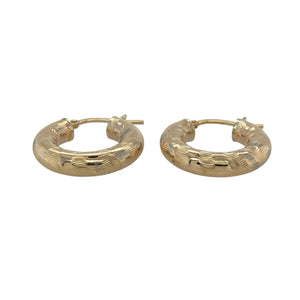 Stylish and eye-catching, these pre-owned 9ct yellow gold creole earrings feature bold stripe detailing—perfect for adding texture and shine to your everyday look.

Design: Each earring showcases a classic creole hoop shape with a stripe-patterned finish, adding dimension and a touch of modern flair.
Material: Made from 9-carat yellow gold, the polished and textured surfaces create a striking contrast that enhances the overall design.
