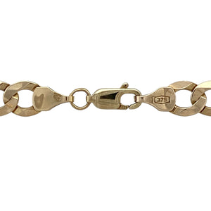 Strong and timeless, this pre-owned 9ct yellow gold curb chain features bold links and a classic finish—perfect for everyday wear or standout styling.

Design: The chain measures 20" in length with 7mm wide flat curb links, offering a sleek, masculine profile with smooth movement and a clean, uniform look.
Material: Made from 9-carat yellow gold, the polished finish enhances the bold link design with a warm, lustrous shine.
