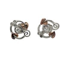 Load image into Gallery viewer, Bring graceful sparkle and symbolic design to your jewellery collection with these pre-owned 925 silver Clogau Tree of Life stud earrings, featuring 9ct rose gold accents and white topaz—perfect for everyday elegance with deeper meaning.

Design: Each stud features the iconic Tree of Life motif, accented with flowing 9ct rose gold detailing and set with white topaz for a subtle, uplifting shimmer.

