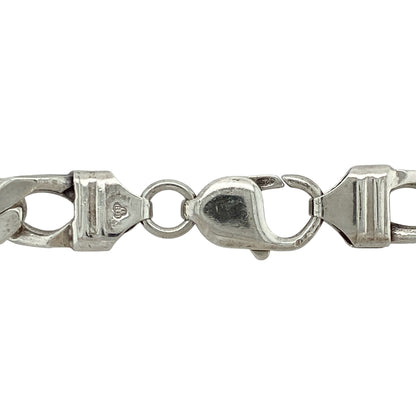 Bring classic strength and polished style to your jewellery collection with this pre-owned 925 silver curb chain necklace, featuring a bold profile and solid weight—perfect for confident everyday wear or standout layering.

Design: This 20-inch chain features a traditional curb link style with a 8mm width, offering a flat, smooth profile that sits comfortably against the neck.
Material: Made from solid 925 sterling silver, the high-shine finish adds brightness and enhances the clean, structured design.
