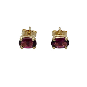 Bring vibrant colour and classic elegance to your jewellery collection with these pre-owned 9ct yellow gold stud earrings, featuring rich purple stones in a timeless oval cut—perfect for everyday wear or subtle evening sparkle.

Design: Each earring features a 6mm by 4mm oval-cut purple stone, offering a refined pop of colour in a clean, understated setting.
Material: Made from 9-carat yellow gold, the polished finish provides a warm contrast to the vivid tone of the stones.
