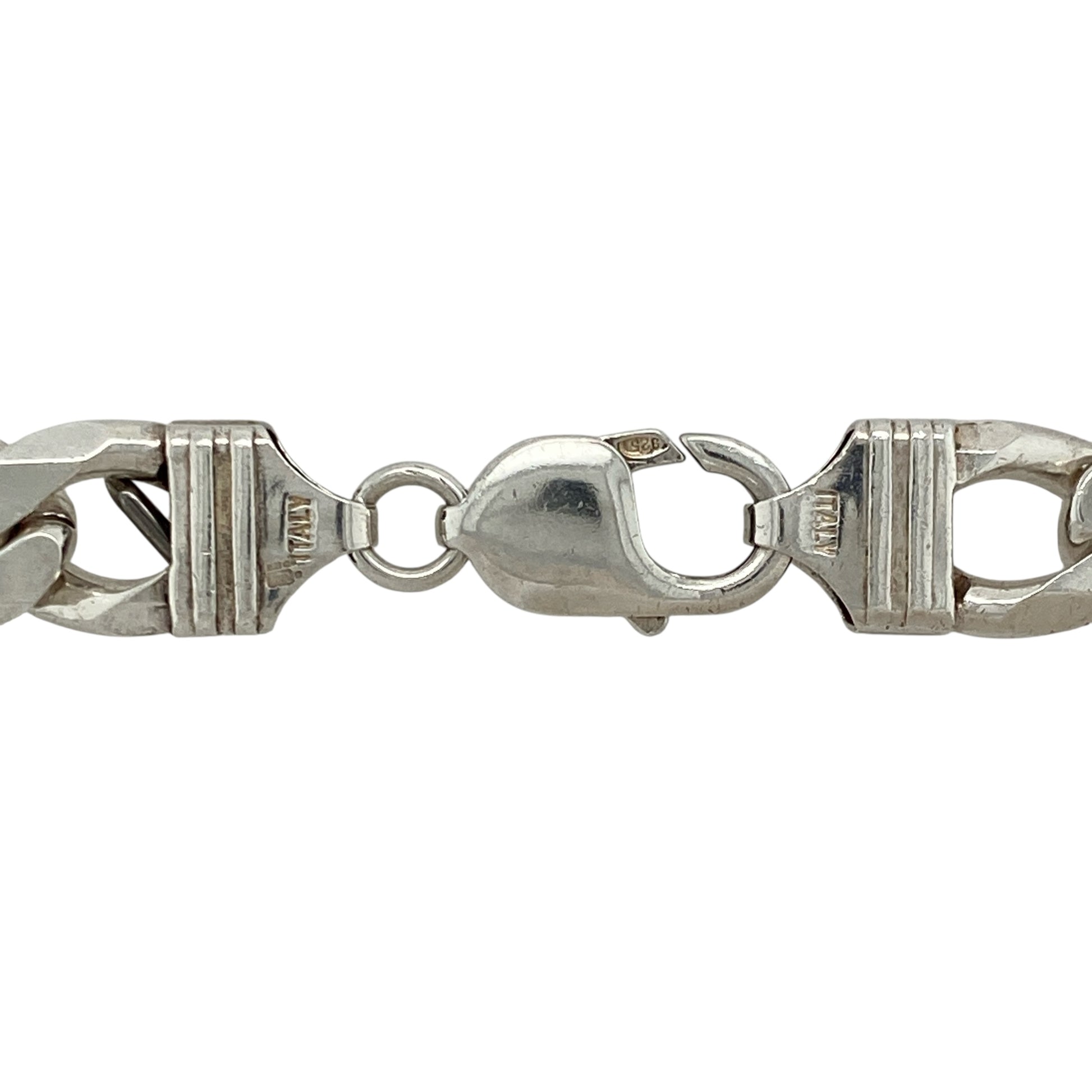 Bring bold presence and timeless appeal to your collection with this pre-owned 925 silver curb chain—perfect for making a confident statement.

Design: The chain features 11mm wide curb links, creating a strong and classic look.
Material: Made from 925 sterling silver, the polished finish enhances the bright tone and smooth profile of each link.
Chain Detail: Measuring 20" in length, the chain offers a comfortable drape and secures with a sturdy clasp for reliable wear.
