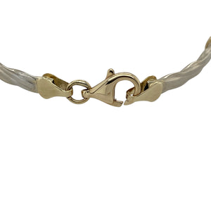 Bring elegant colour and timeless style to your collection with this pre-owned 9ct yellow and white gold amethyst kiss bar twist bracelet—perfect for adding a refined touch to any outfit.

Design: The 7.5" bracelet features alternating yellow gold twist bars and white gold ‘kiss’ links, each set with a 6mm by 4mm oval amethyst for a vibrant pop of purple.
Material: Made from 9-carat yellow and white gold, the two-tone finish enhances the rich hue of the amethysts while adding visual contrast.

