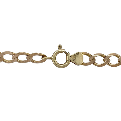 Bring classic style and versatile wear to your collection with this pre-owned 9ct yellow gold curb chain—perfect for wearing alone or pairing with a favourite pendant.

Design: The chain features traditional curb links measuring 5mm in width, offering a timeless and masculine look.
Material: Made from 9-carat yellow gold, the polished finish enhances the warm tone and smooth link profile.
Chain Detail: At 26" in length, the chain sits lower on the chest, making it ideal for layering or standalone wear.
