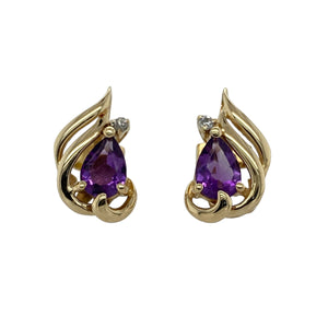 Bring graceful curves and vibrant colour to your collection with these pre-owned 14ct yellow gold diamond and amethyst teardrop swirl stud earrings—perfect for adding elegance to any occasion.

Design: Each earring features a 7mm by 5mm teardrop-shaped amethyst framed in a flowing swirl design, accented by sparkling diamonds for added brilliance.
Material: Made from 14-carat yellow gold, the polished finish enhances the rich purple of the amethysts and the sparkle of the diamonds.
