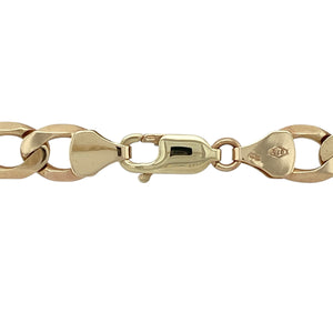 Bring bold presence and timeless strength to your collection with this pre-owned 9ct yellow gold curb chain, offering a heavyweight design with classic appeal—perfect as a statement piece or luxury everyday accessory.

Design: The chain measures 22" in length with an 8mm link width, giving it a wide and powerful profile.
Material: Made from 9-carat yellow gold, the polished finish enhances the solid curb links with a rich golden shine.
