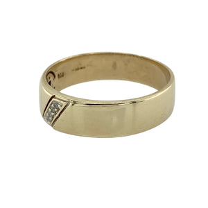 Bring meaningful detail and timeless style to your collection with this pre-owned 9ct yellow gold diamond band ring, combining classic design with a romantic message—perfect as a symbolic gift or everyday keepsake.

Design: The band measures 6mm wide and features four small diamonds set at the front, adding subtle sparkle to the polished gold.
Material: Made from 9-carat yellow gold, the polished finish provides a warm backdrop that enhances the diamonds’ brilliance.
