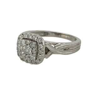 Bring brilliance and vintage-inspired elegance to your collection with this pre-owned 9ct white gold diamond halo cluster ring—a sparkling design with timeless appeal.

Design: The ring features a 10mm high halo cluster set with diamonds, framed by twisted milgrain edge shoulders for added texture and vintage charm.
Material: Made from 9-carat white gold, the polished finish enhances the bright tone and complements the sparkle of the diamonds.