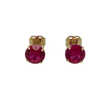 Load image into Gallery viewer, Bring a touch of colour and elegance to your collection with these pre-owned 9ct yellow gold stud earrings, featuring vibrant ruby-coloured stones for a classic and versatile look.

Design: Each earring is set with a round ruby-coloured stone measuring 5mm in diameter, offering a striking pop of rich red.
Material: Made from 9-carat yellow gold, the polished finish enhances the warmth of the gold and complements the vivid stones.
