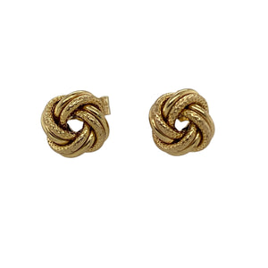 Bring timeless style and subtle detail to your collection with these pre-owned 9ct yellow gold stud earrings, designed in a classic knot shape with textured finish.

Design: Each earring features an 8mm knot motif, enhanced with a textured pattern for added depth and character.
Material: Made from 9-carat yellow gold, the polished and textured surfaces combine to highlight the warm golden tone.
Earring Detail: The knot design symbolises unity and eternity, making these studs both meaningful and stylish.