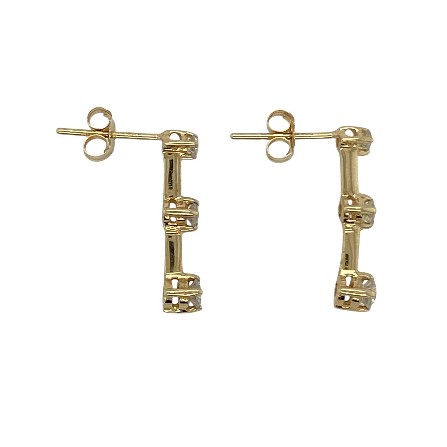 Bring subtle sparkle and modern elegance to your collection with these pre-owned 14ct yellow gold diamond bar stud earrings, a versatile design perfect for day or evening wear.

Design: Each stud features a sleek bar design, set with three sparkling diamonds that create a refined and contemporary look.
Material: Made in 14-carat yellow gold, the polished finish provides a warm glow that enhances the brilliance of the diamonds.