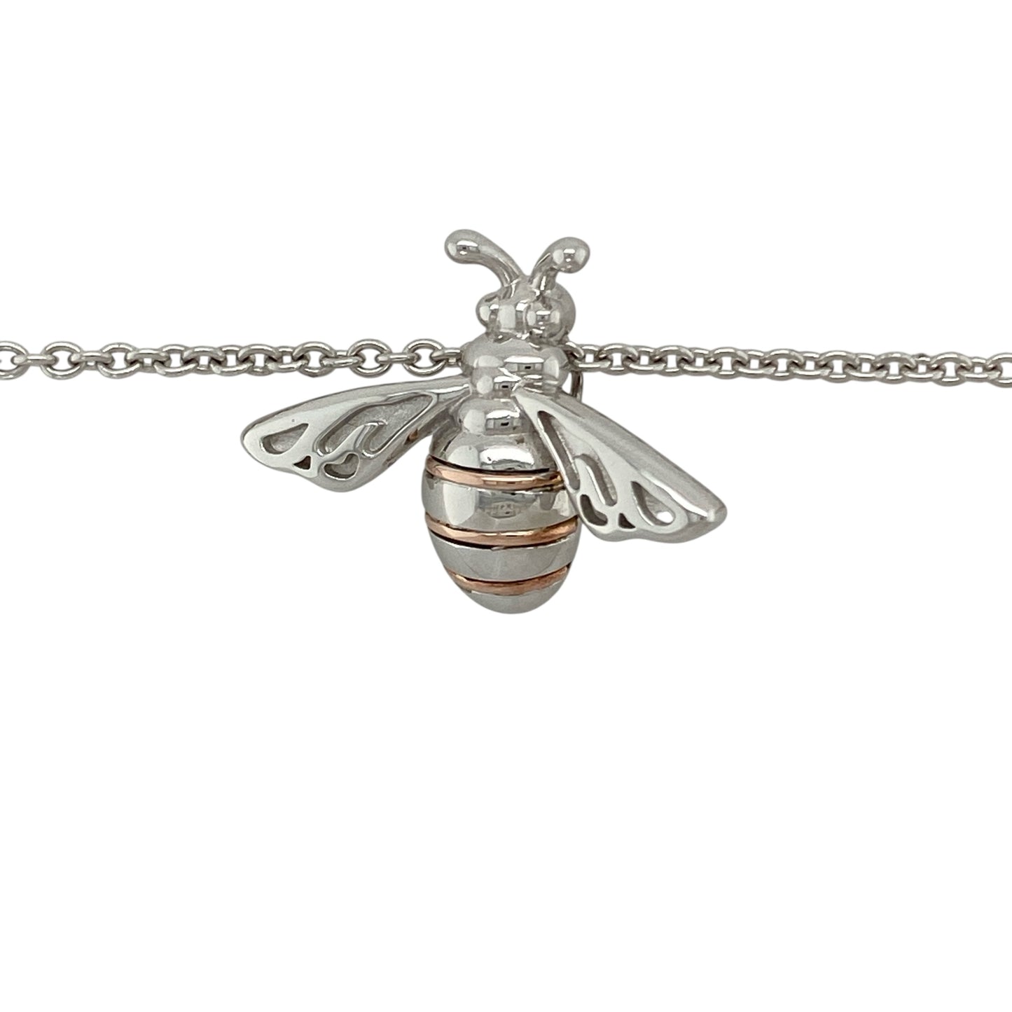 Bring nature-inspired charm and golden detail to your collection with this pre-owned Clogau honey bee pendant in silver and 9ct rose gold, paired with an adjustable belcher chain for versatile wear.

Design: The pendant measures 2.2cm long and features a delicately detailed honey bee motif, symbolising community, diligence, and nature’s beauty, highlighted with 9ct rose gold accents.