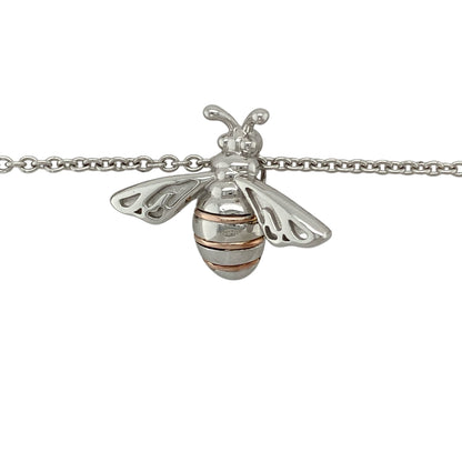 Bring nature-inspired charm and golden detail to your collection with this pre-owned Clogau honey bee pendant in silver and 9ct rose gold, paired with an adjustable belcher chain for versatile wear.

Design: The pendant measures 2.2cm long and features a delicately detailed honey bee motif, symbolising community, diligence, and nature’s beauty, highlighted with 9ct rose gold accents.